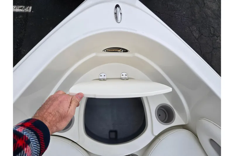 Slide: The Image of 2008 Stingray 195 LS/LX/LR boat storage compartment being opened. - 17