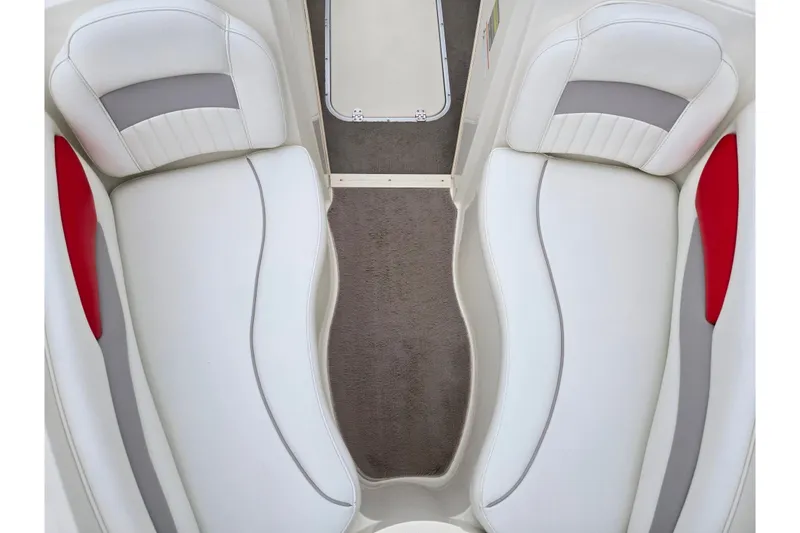 Slide: The Image of 2008 Stingray 195 LS/LX/LR boat interior with white and gray seating, red accents. - 18