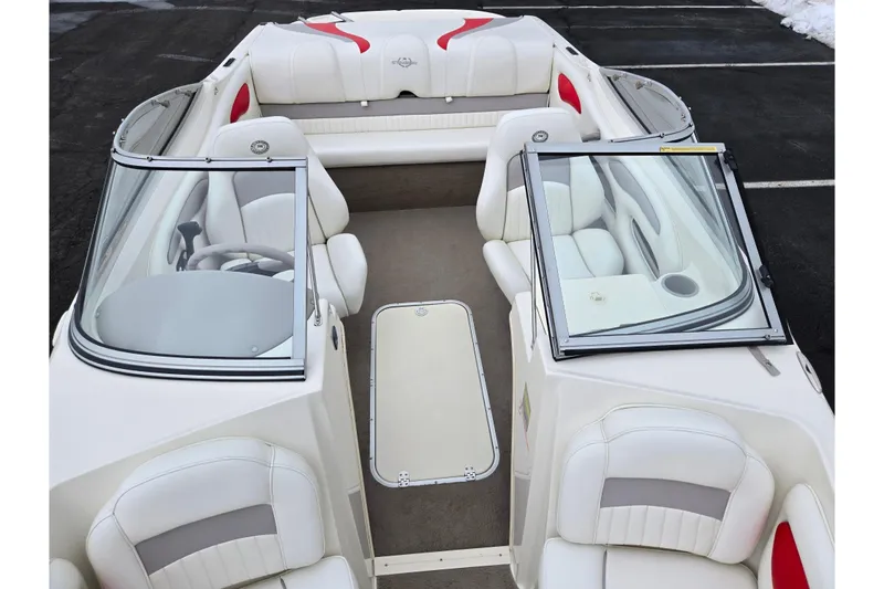 Slide: The Image of 2008 Stingray 195 LS/LX/LR boat interior with white seating and open windshield. - 19