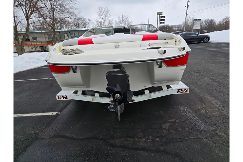 Slide: The Image of 2008 Stingray 195 LS/LX/LR boat on trailer, parked in snowy lot. - 2