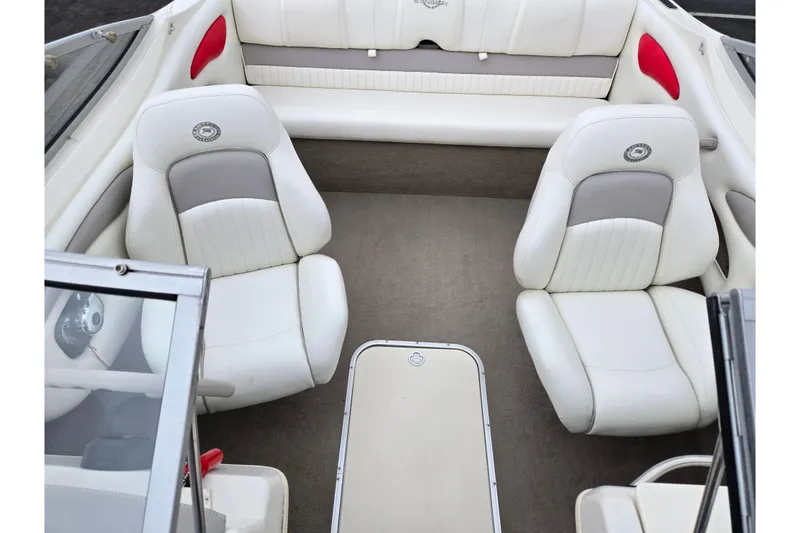 Slide: The Image of 2008 Stingray 195 LS/LX/LR boat interior with white and gray seating. - 20