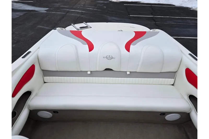 Slide: The Image of 2008 Stingray 195 LS/LX/LR boat interior with white and red seating. - 21