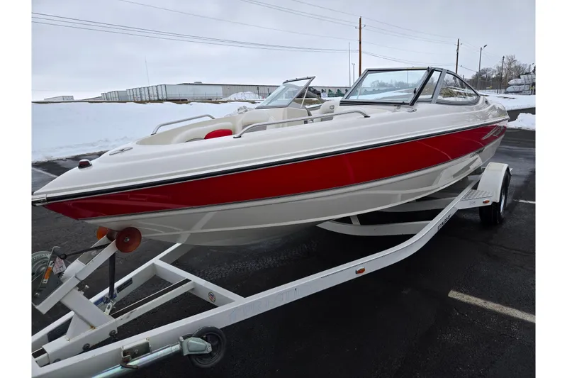 Slide: The Image of 2008 Stingray 195 LS/LX/LR boat on trailer, red and white design, parked on snowy pavement. - 5