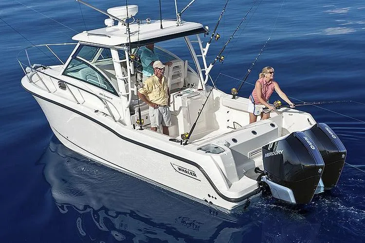The Image of Manufacturer Provided Image: 2026 Boston Whaler 285 Conquest boat on water, two people fishing, dual Mercury engines. - 0