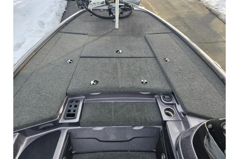 Slide: The Image of 2013 Nitro Z-9 boat deck with carpeted surface and storage compartments. - 14