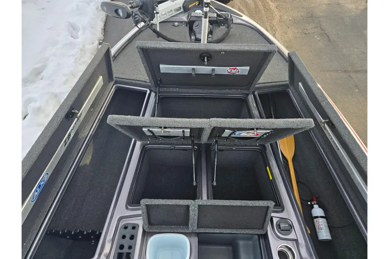 Slide: The Image of 2013 Nitro Z-9 boat interior with open storage compartments and equipment. - 15