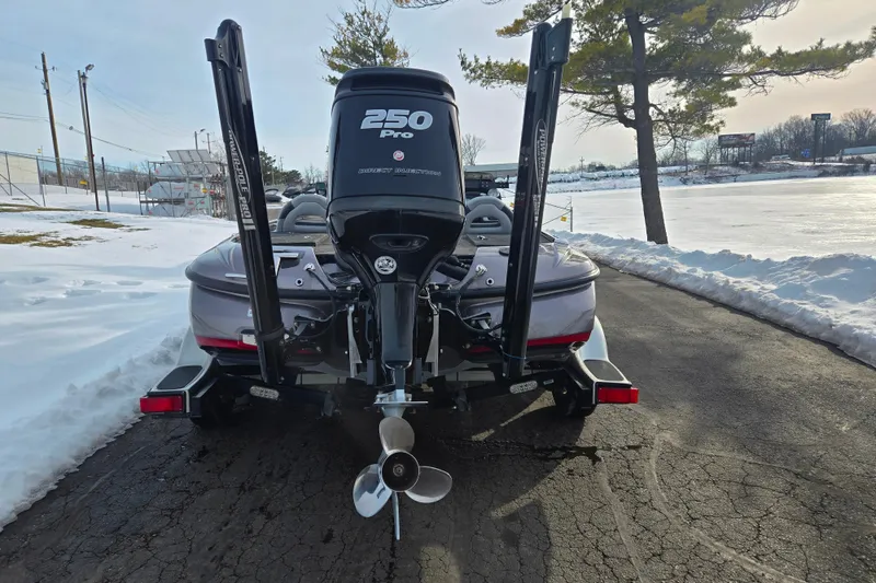 Slide: The Image of 2013 Nitro Z-9 boat with 250 Pro engine on snowy lakeside. - 2