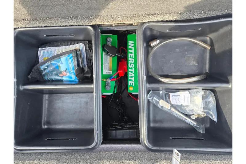 Slide: The Image of Storage compartments in a 2013 Nitro Z-9 boat with battery and accessories. - 24