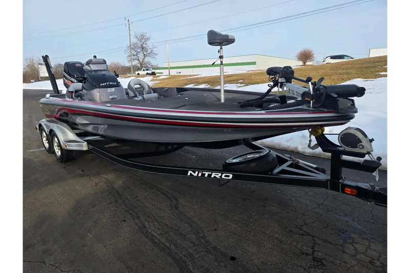 Slide: The Image of 2013 Nitro Z-9 fishing boat on trailer, parked on a snowy road. - 5
