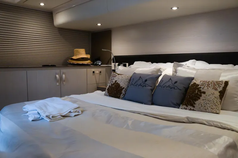 Slide: The Image of Luxurious bedroom interior of 2019 Azimut Fly 50 yacht with elegant decor and soft lighting. - 12