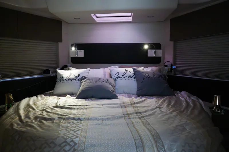 Slide: The Image of Luxurious bedroom interior of 2019 Azimut Fly 50 yacht with elegant bedding and ambient lighting. - 16