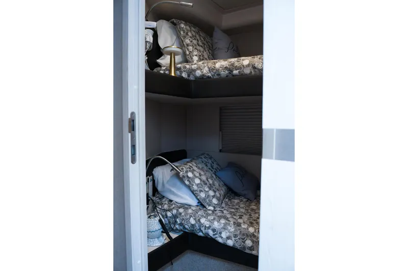 Slide: The Image of Cozy bunk beds in 2019 Azimut Fly 50 yacht cabin, featuring patterned bedding. - 21