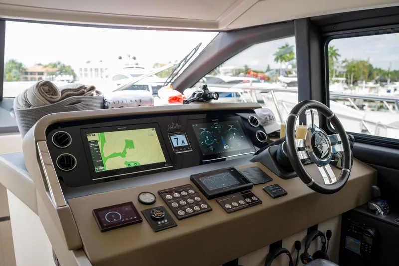 Slide: The Image of Cockpit of 2019 Azimut Fly 50 yacht with advanced navigation controls and steering wheel. - 23