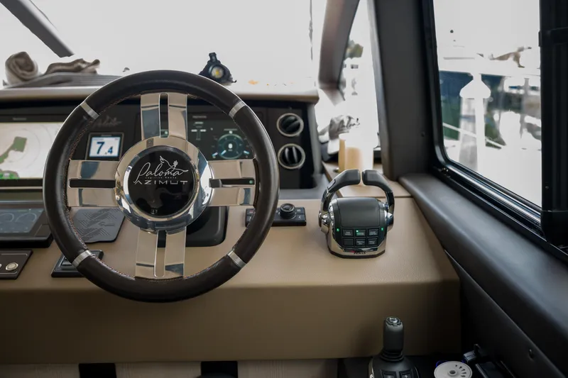 Slide: The Image of Steering wheel and controls of 2019 Azimut Fly 50 yacht cockpit. - 25