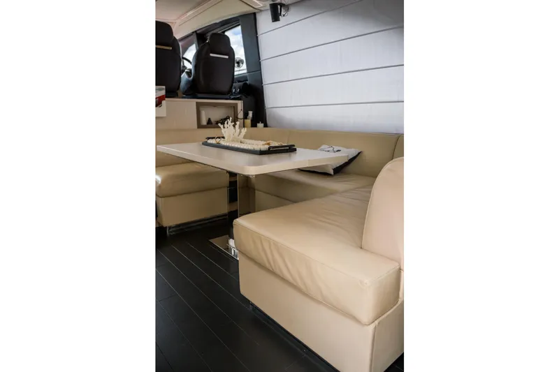 Slide: The Image of Luxurious interior of 2019 Azimut Fly 50 yacht with beige seating and elegant table. - 26