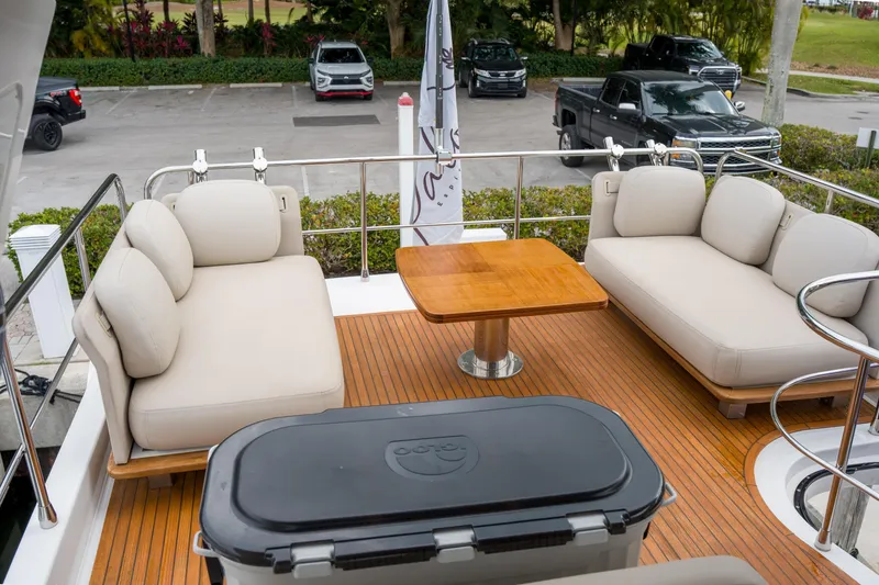 Slide: The Image of Luxurious 2019 Azimut Fly 50 yacht deck with plush seating and wooden table. - 32