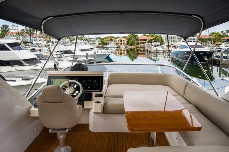 Slide: The Image of Luxurious 2019 Azimut Fly 50 yacht interior with helm, seating, and marina view. - 33