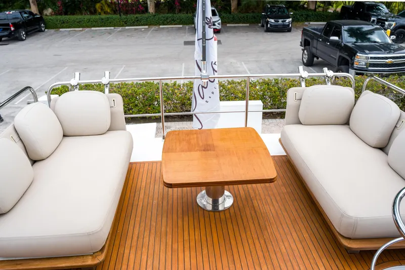 Slide: The Image of Luxurious 2019 Azimut Fly 50 yacht deck with elegant seating and wooden table. - 34