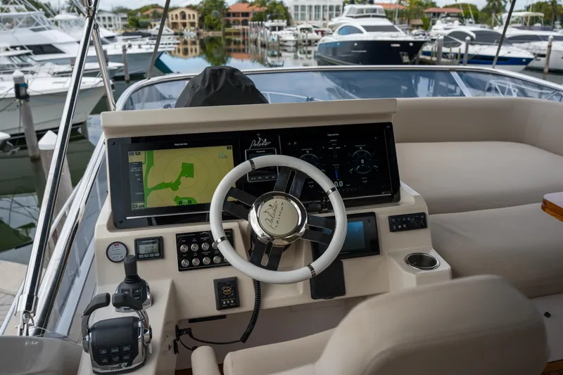 Slide: The Image of 2019 Azimut Fly 50 yacht helm with advanced navigation system and luxurious seating. - 35