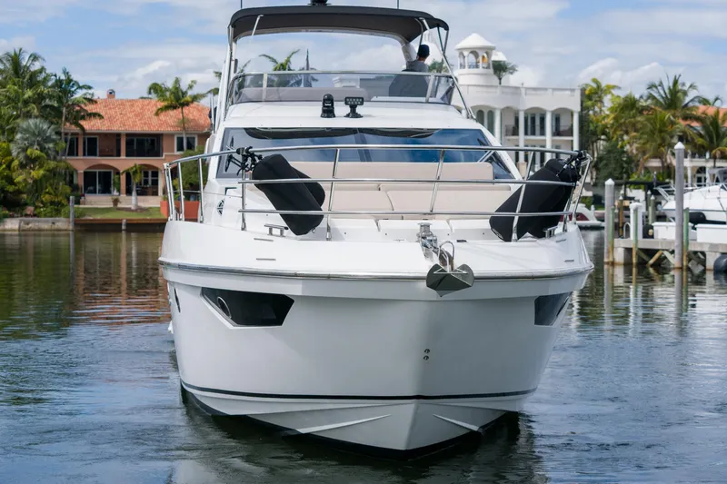 Slide: The Image of Front view of a 2019 Azimut Fly 50 yacht docked in a marina. - 4