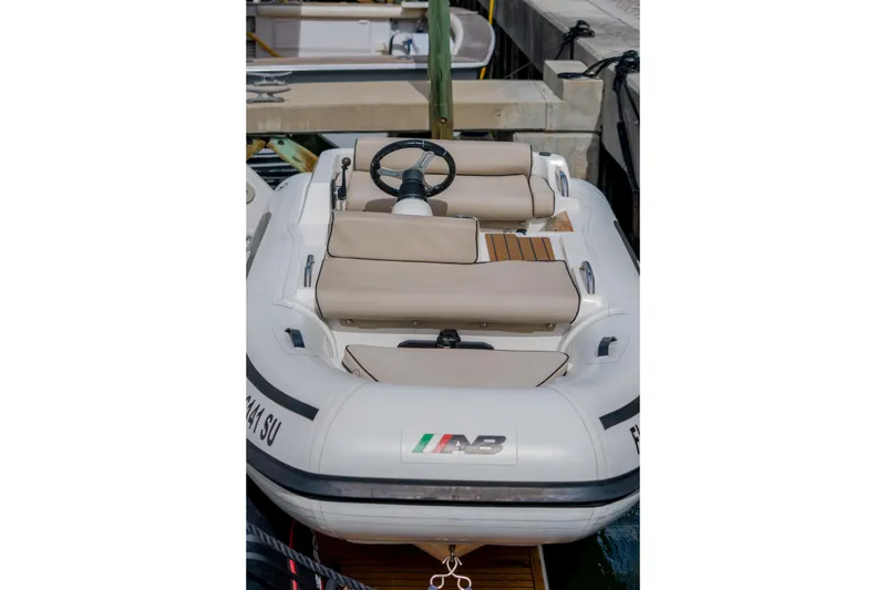 Slide: The Image of 2019 Azimut Fly 50 yacht with beige seating, docked at marina. - 43