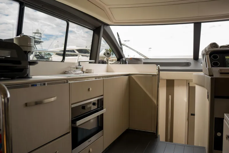Slide: The Image of Luxurious interior of 2019 Azimut Fly 50 yacht with modern kitchen amenities. - 9