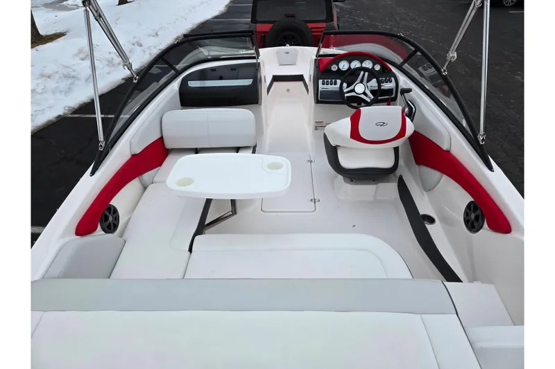 Slide: The Image of 2017 Regal 1900 ESX Bowrider interior with red accents and steering wheel. - 10