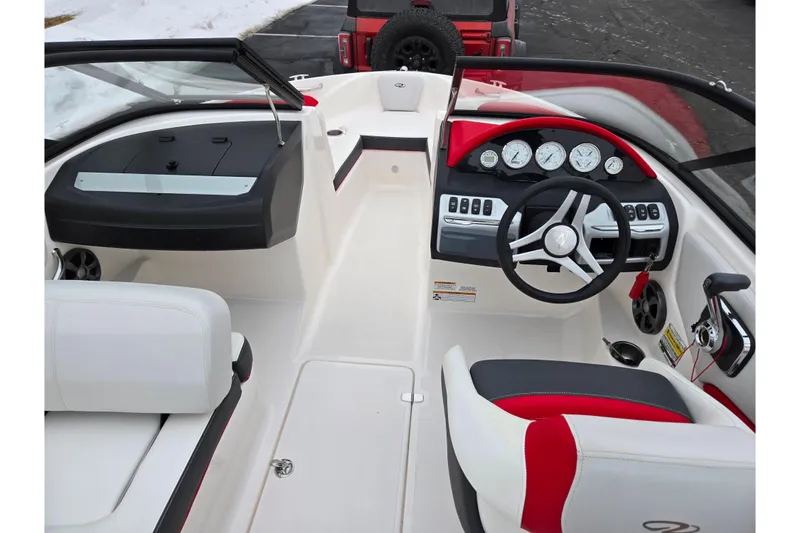 Slide: The Image of 2017 Regal 1900 ESX Bowrider interior with steering wheel and dashboard controls. - 11