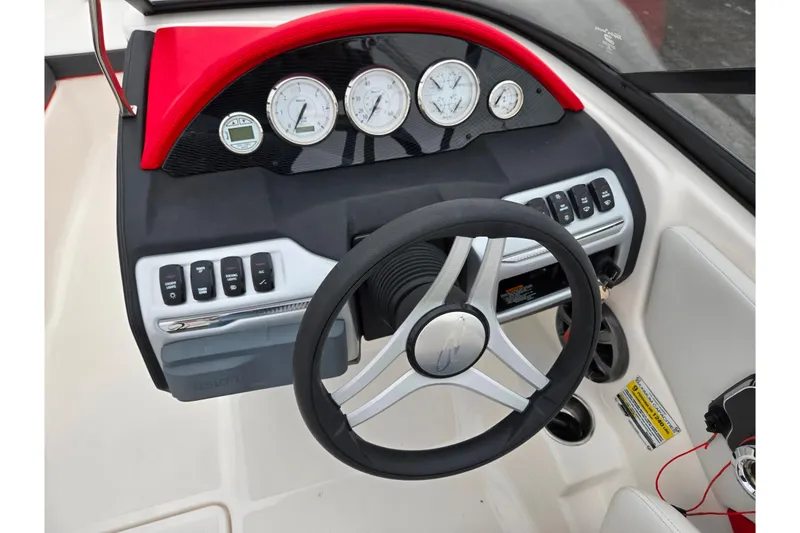 Slide: The Image of 2017 Regal 1900 ESX Bowrider dashboard with steering wheel and control panel. - 13