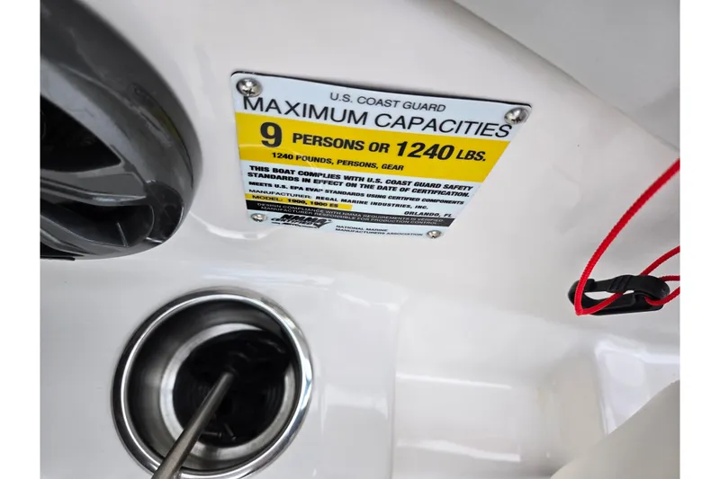 Slide: The Image of 2017 Regal 1900 ESX Bowrider capacity label, 9 persons or 1240 lbs, safety compliance. - 14