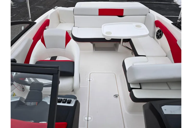 Slide: The Image of 2017 Regal 1900 ESX Bowrider interior with white and red seating, table, and steering wheel. - 20