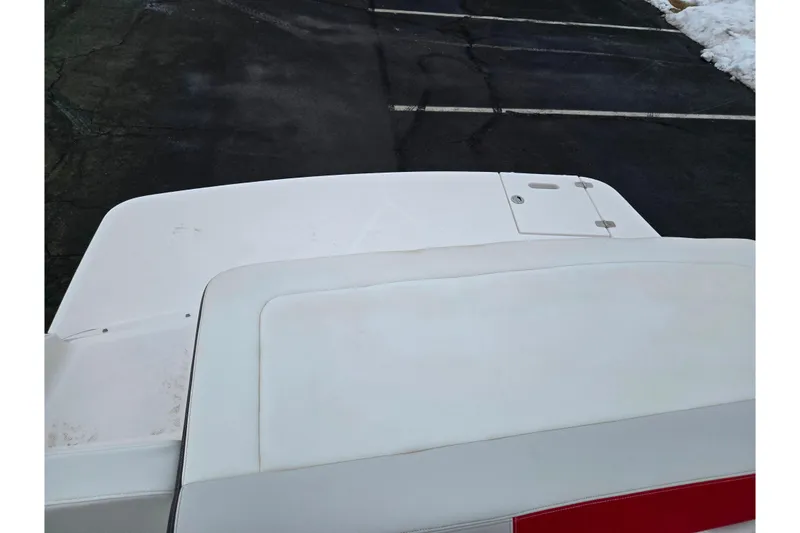 Slide: The Image of 2017 Regal 1900 ESX Bowrider boat, white deck view, parked on asphalt. - 23