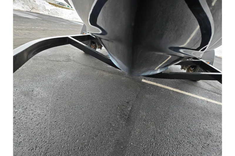 Slide: The Image of 2017 Regal 1900 ESX Bowrider on trailer, close-up view of hull and frame. - 7