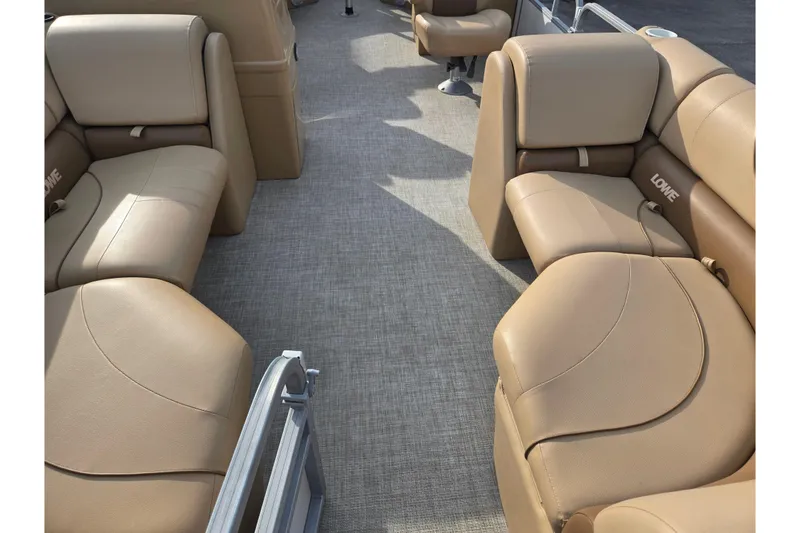 Slide: The Image of 2021 Lowe SS 230 WT boat interior with tan seating and spacious layout. - 11