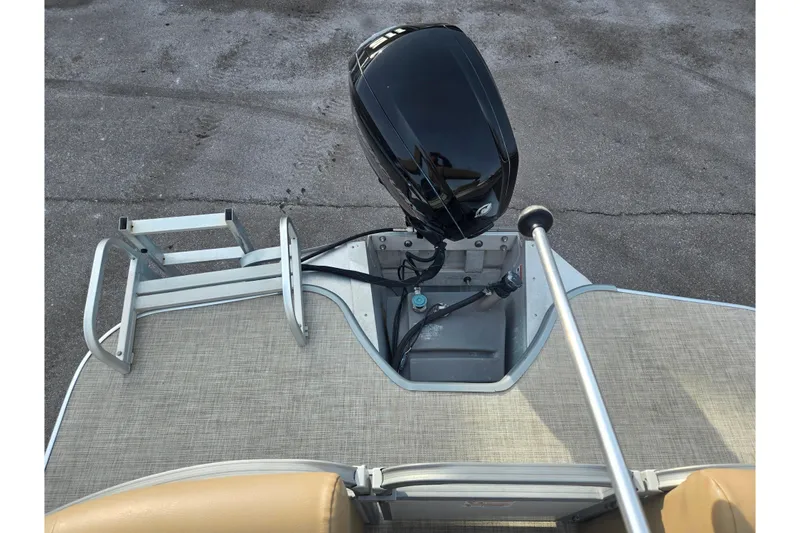 Slide: The Image of 2021 Lowe SS 230 WT boat with outboard motor and ladder on deck. - 17