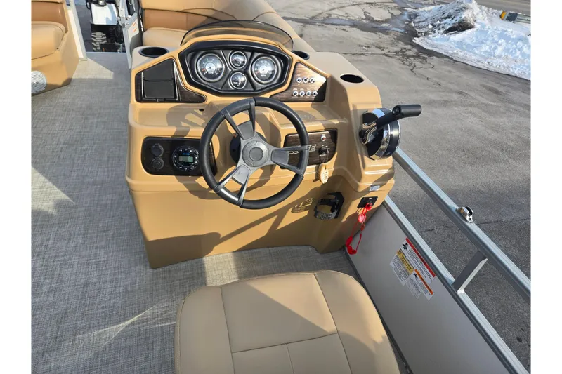 Slide: The Image of 2021 Lowe SS 230 WT boat helm with steering wheel and controls. - 20
