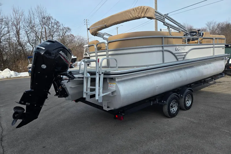 Slide: The Image of 2021 Lowe SS 230 WT pontoon boat with Mercury outboard motor on trailer. - 3