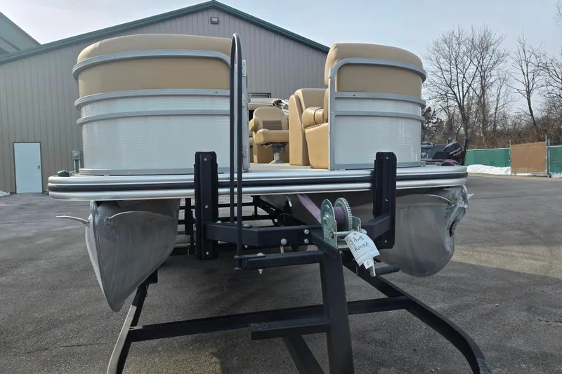 Slide: The Image of 2021 Lowe SS 230 WT pontoon boat on trailer, parked outdoors. - 6