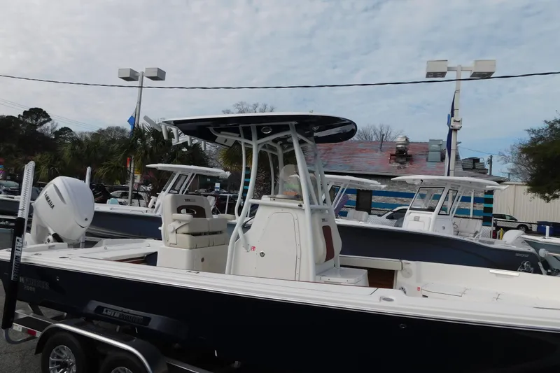 Slide: The Image of 2026 Pathfinder 2600 TRS boat displayed outdoors with Yamaha engine. - 15