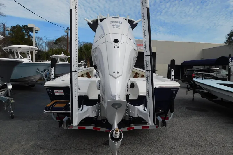 Slide: The Image of 2026 Pathfinder 2600 TRS boat with powerful engine, displayed outdoors. - 16