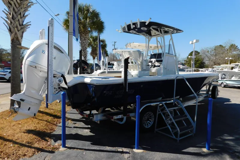 Slide: The Image of 2026 Pathfinder 2600 TRS boat with Yamaha engine on display at dealership. - 19