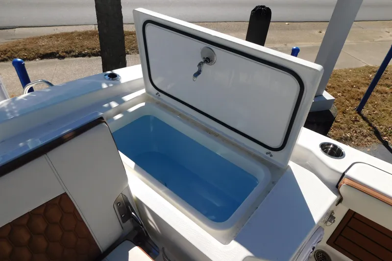 Slide: The Image of Open storage compartment on 2026 Pathfinder 2600 TRS boat, showcasing interior design. - 25