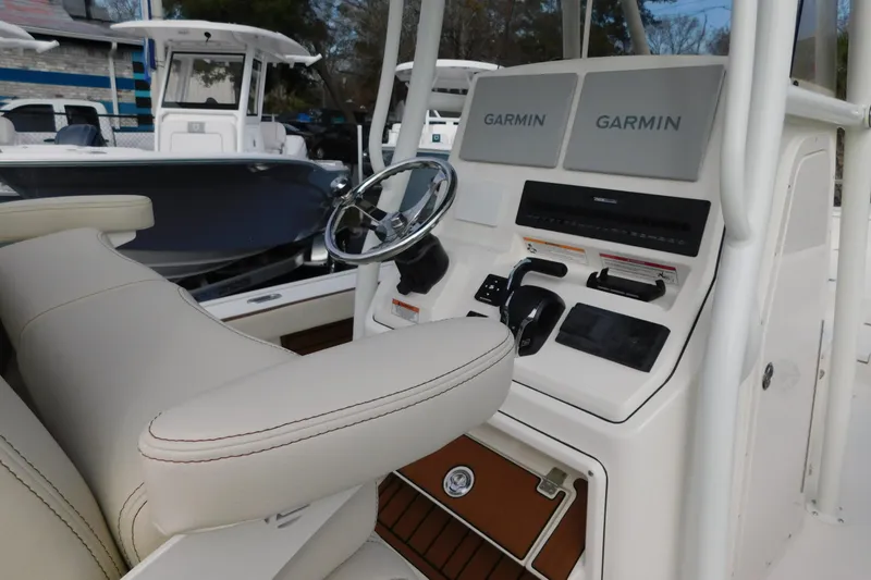 Slide: The Image of 2026 Pathfinder 2600 TRS boat console with Garmin navigation system and steering wheel. - 3