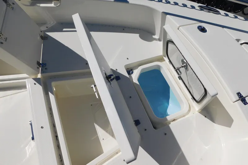 Slide: The Image of 2026 Pathfinder 2600 TRS boat storage compartments and livewell, open view. - 32