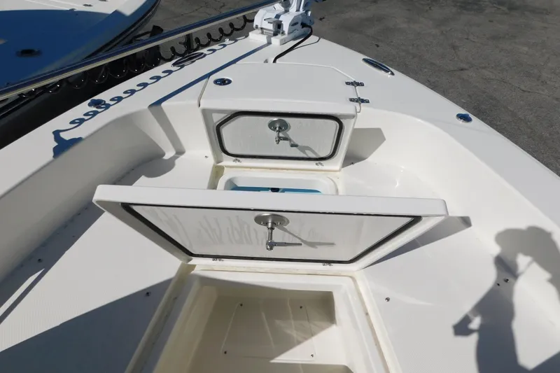 Slide: The Image of 2026 Pathfinder 2600 TRS boat storage compartments open on deck. - 34