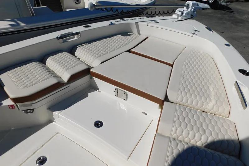 Slide: The Image of 2026 Pathfinder 2600 TRS boat interior with cushioned seating and modern design. - 41