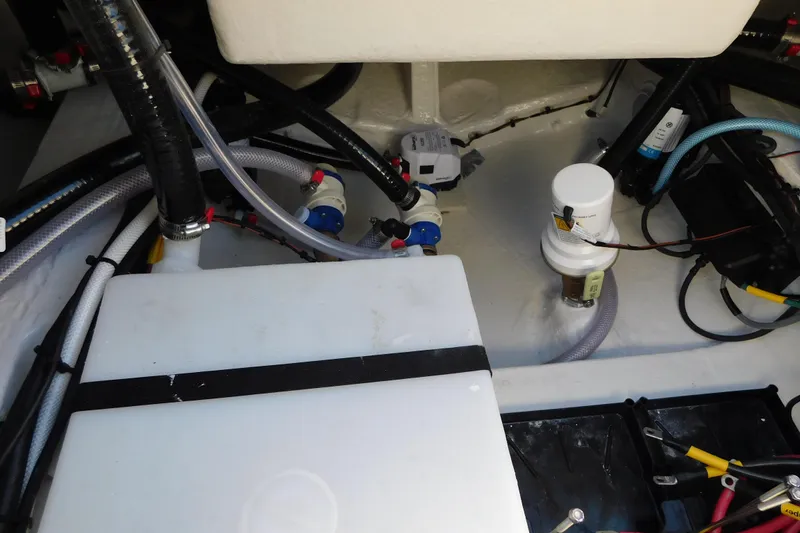 Slide: The Image of Engine compartment of 2026 Pathfinder 2600 TRS boat, showcasing hoses and components. - 45