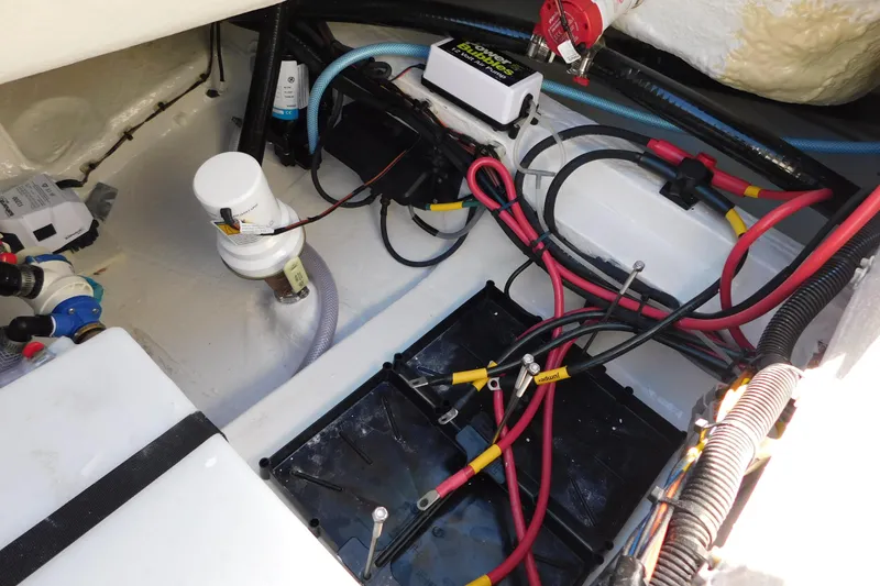 Slide: The Image of 2026 Pathfinder 2600 TRS boat wiring and battery compartment with cables and components. - 46