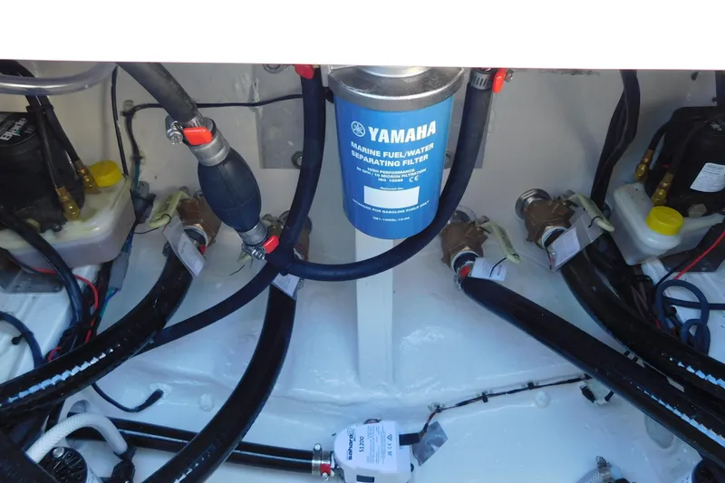 Slide: The Image of Engine compartment of 2026 Pathfinder 2600 TRS with Yamaha marine fuel filter. - 48