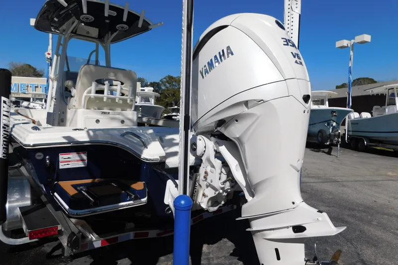 Slide: The Image of 2026 Pathfinder 2600 TRS boat with Yamaha V6 outboard motor displayed outdoors. - 53